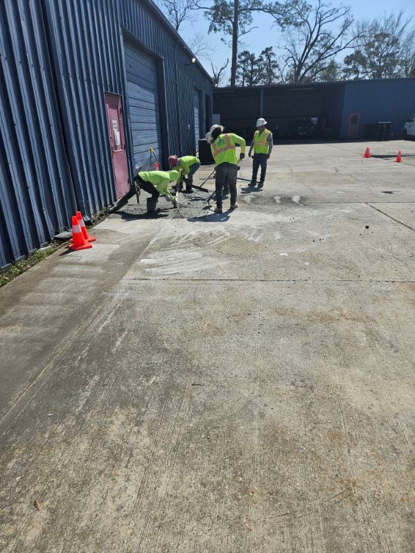 Bright, widened interior corridor with new recessed lighting and modern wall finishes.