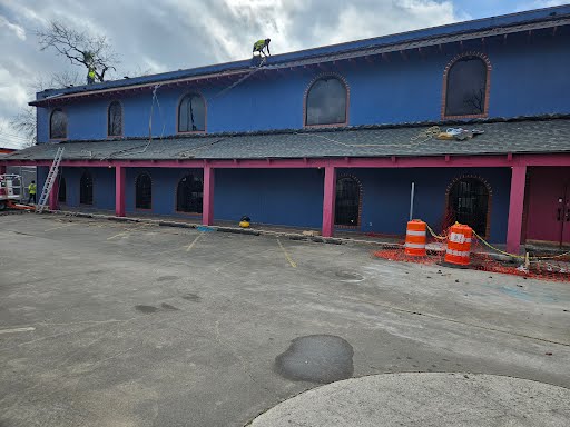 Wide shot of the exterior architecture of the 707 Lehman Street commercial building.