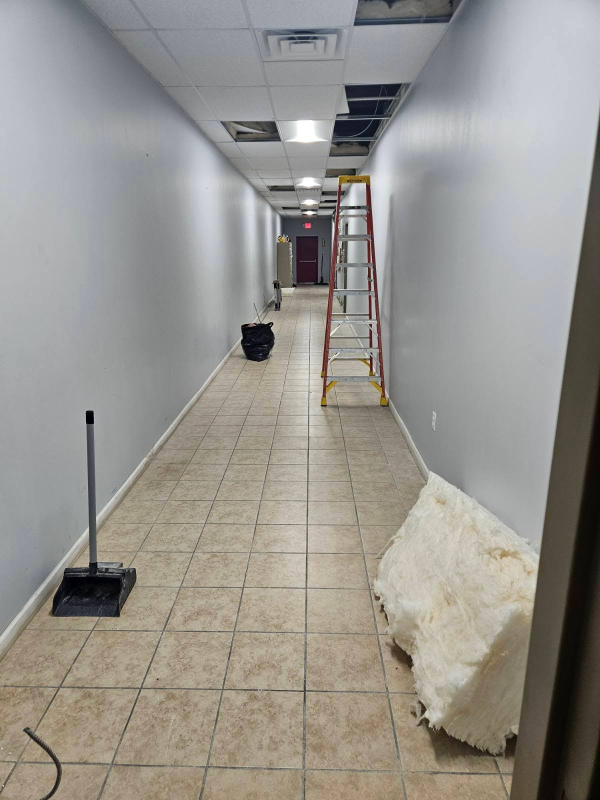 Wide interior view of the modern, renovated HEART Program workspace with new furniture.