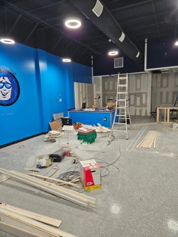 Electrical boxes and wiring installed in metal studs during a commercial construction build-out.